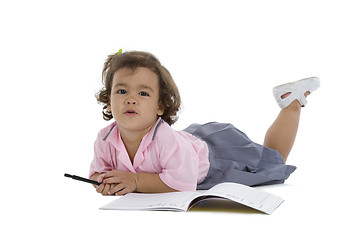 Image showing cute girl with notebook and pen