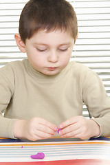 Image showing Boy with plasticine