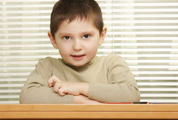 Image showing Cute boy arms folded