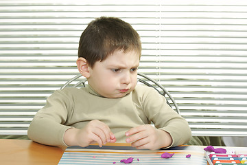 Image showing Funny boy with plasticine