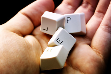 Image showing HELP - keyboard in a hand ! Close-up with great details !