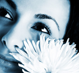 Image showing Girl with a white flower