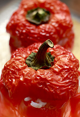 Image showing Red peppers with rice stuffing