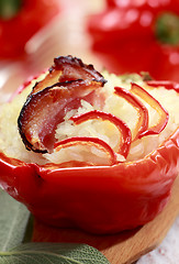 Image showing Red pepper with bacon and rice stuffing