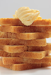 Image showing Piled toast bread slices with butter