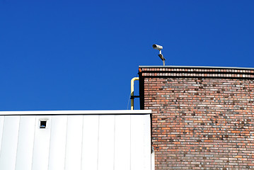 Image showing Security camera against blue sky 