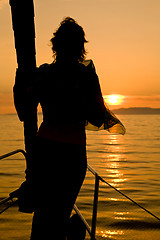 Image showing woman silhouette on yacht nose