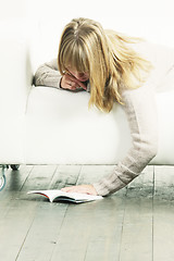 Image showing Woman and book on floor