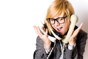 Image showing businesswoman with three phones