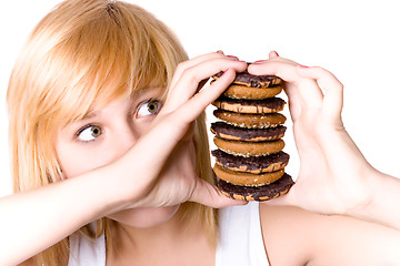 Image showing young woman with cookies