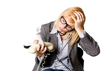 Image showing businesswoman with three phones 