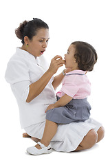 Image showing mother feeding her little girl