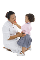 Image showing cute girl feeding her mother