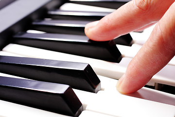 Image showing hands playing music on the piano, hands and piano player, keyboa