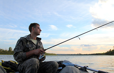 Image showing men fishing with spinning