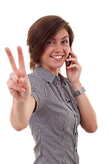 Image showing woman with phone and victory gesture