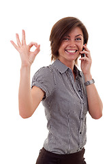 Image showing woman with phone and ok gesture