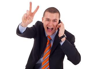 Image showing  man making victory sign on phone