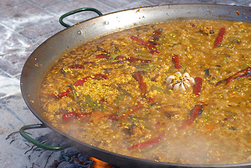 Image showing Paella cooking