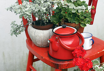 Image showing Chair and with flowers on top