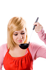 Image showing young housewife with soup ladle