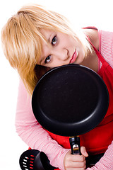 Image showing sad housewife with pan