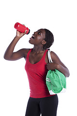 Image showing Athlete woman drinking water