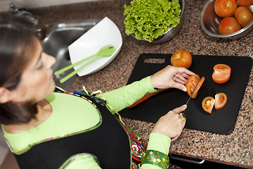 Image showing Woman preparing food at the kitchen