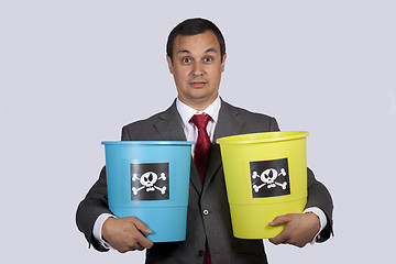 Image showing Businessman holding dangerouse buckets