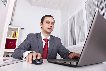 Image showing Mature businessman working at the office