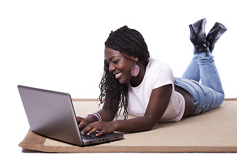 Image showing young african woman working with her laptop