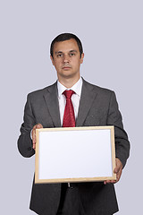 Image showing businessman holding a whiteboard