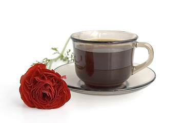 Image showing A cup of coffee and red flower