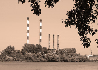Image showing Factory by river