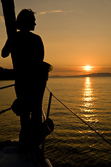 Image showing sunset seascape with woman silhouette