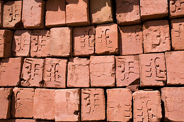 Image showing red bricks with arabic symbols