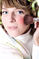 Image showing  woman applying make-up 
