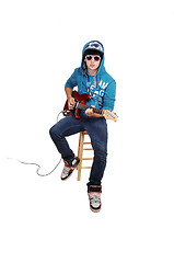 Image showing Teen boy with guitar.