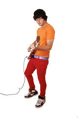 Image showing Teen boy with guitar.