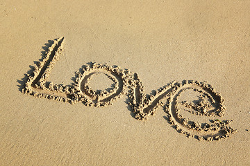 Image showing love write on sand