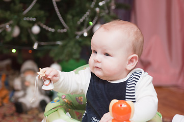 Image showing The kid at a New Year tree