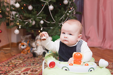 Image showing The kid at a New Year tree