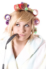 Image showing funny housewife with curlers