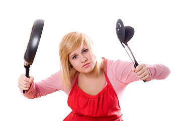 Image showing pretty housewife with kitchen utensil and pan