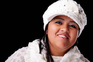 Image showing Portrait of a young latin woman smiling, in autumn/winter clothes