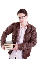 Image showing young and beautiful boy, with books on the hands