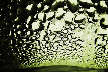Image showing Green drops of water - light from backside. Macro