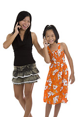 Image showing mother and daughter on the phone