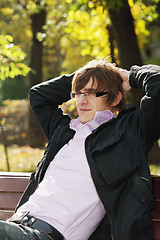 Image showing Young pensive man in park