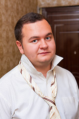 Image showing Portrait of a young man wearing shirt with unfastened necktie